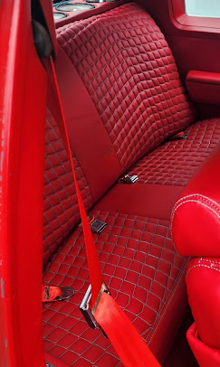 Custom red diamond-stitched truck interior by Johnson's Upholstery
